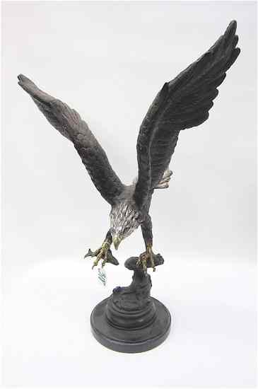 Appraisal: POLYCHROME BRONZE WILDLIFE SCULPTURE of an eagle with fish wings