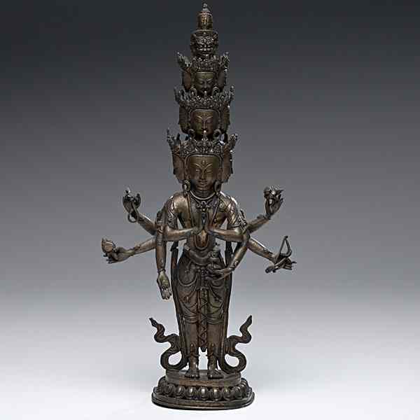 Appraisal: Bronze Statue of an Eleven-Headed Avalokitesvara Chinese a multi-faceted bronze