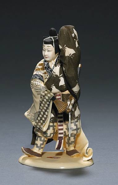 Appraisal: A polychromed ivory figural okimono Showa Period Depicting a Japanese