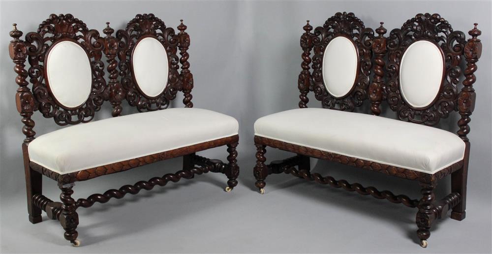 Appraisal: PAIR OF BAROQUE STYLE MAHOGANY HALL BENCHES each with foliate