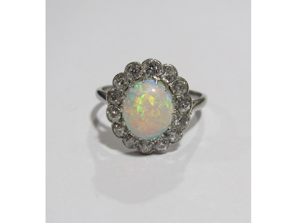 Appraisal: White gold opal and diamond cluster ring