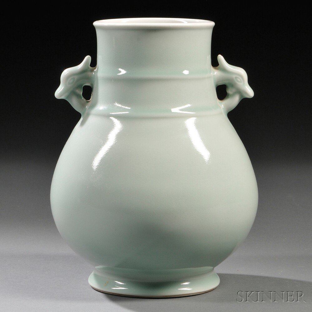 Appraisal: Celadon Hu Vase China th century with two deer-head-shaped ears