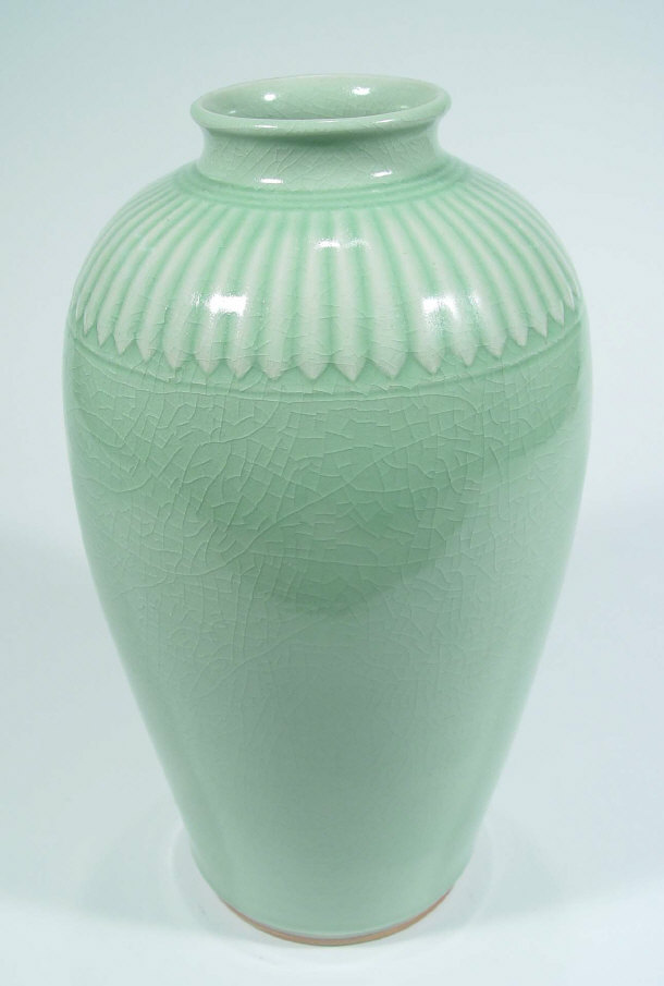 Appraisal: Oriental stoneware baluster vase with green celagon glaze and incised