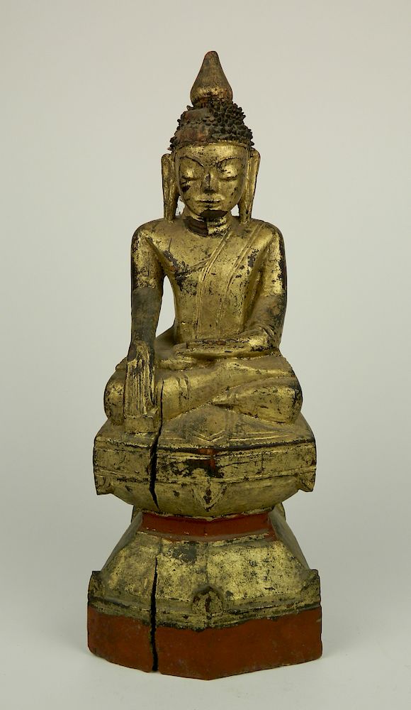 Appraisal: Carved and gilded wood Buddha th thc Carved and gilded