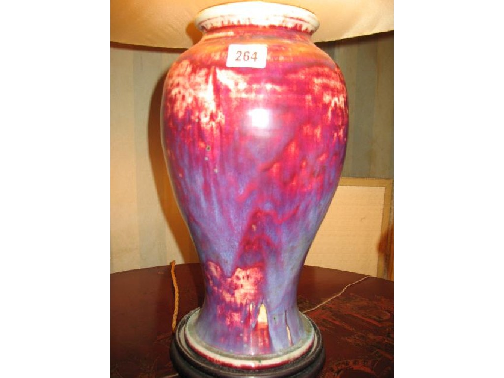 Appraisal: A SANG DE BOEUF STYLE VASE with a slender baluster