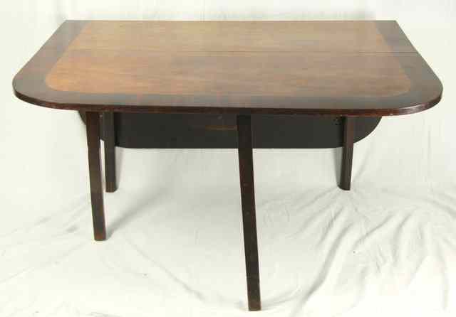 Appraisal: A George III mahogany drop leaf table with crossbanded top