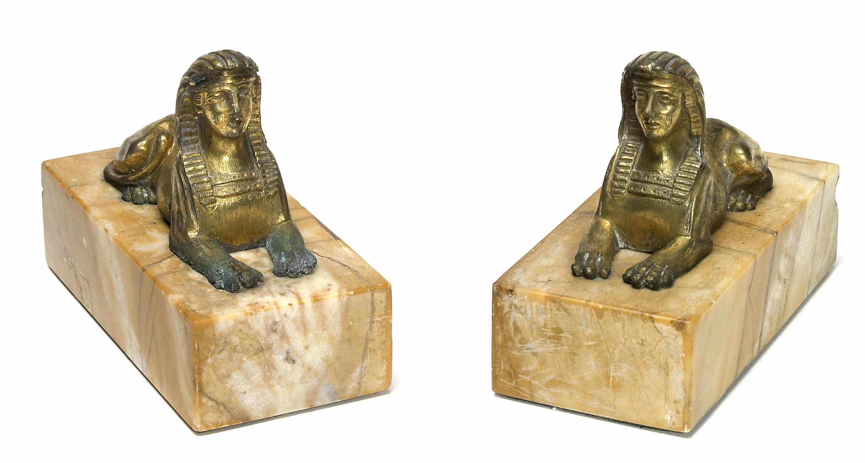 Appraisal: A pair of French gilt bronze models of sphinxes late