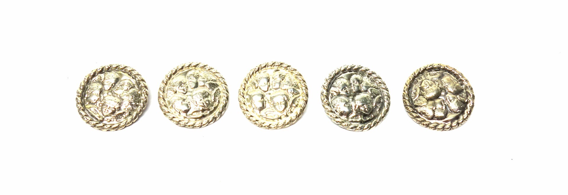 Appraisal: Five silver shaped circular buttons each decorated to the centre