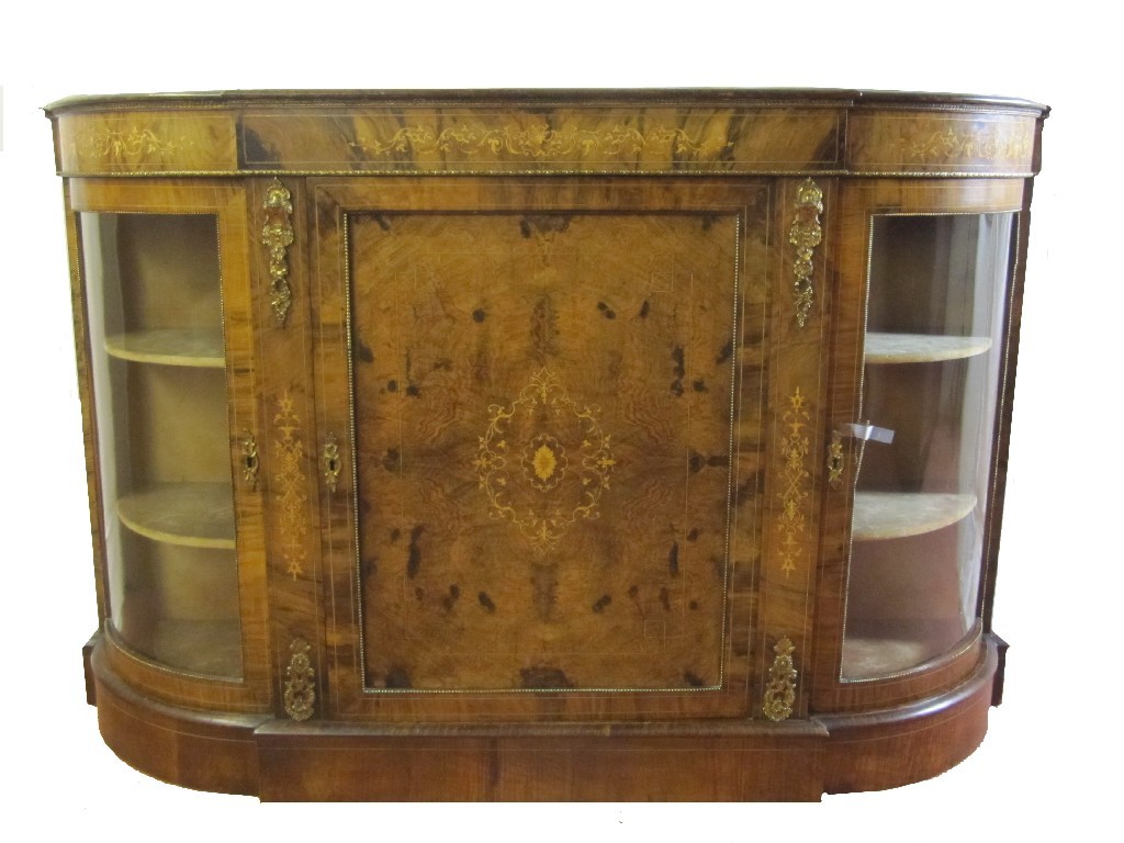 Appraisal: A Victorian walnut credenza the central door inlaid with a