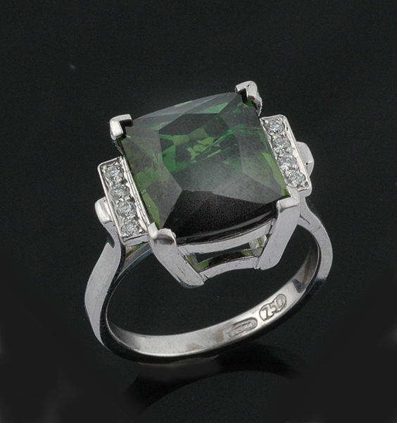 Appraisal: A green tourmaline and diamond ring The cushion cut tourmaline