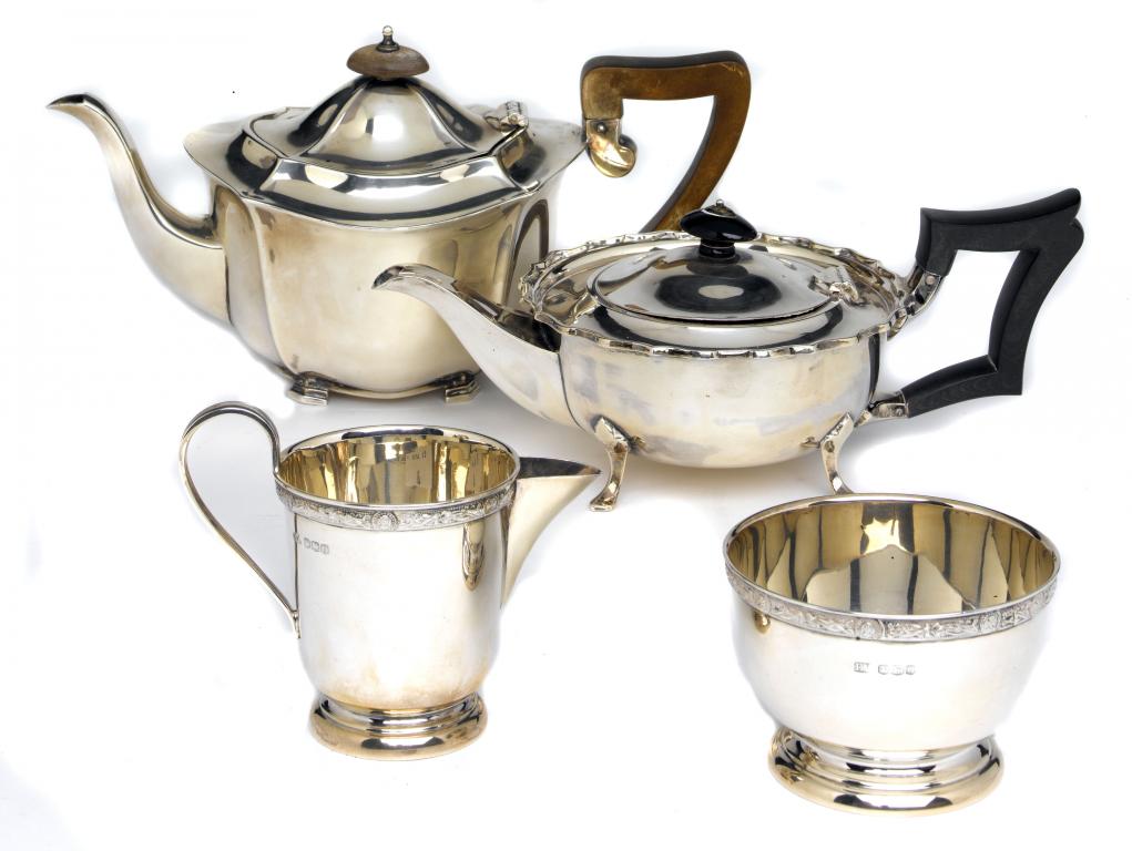 Appraisal: TWO TEAPOTS AND A MATCHING CREAM JUG AND SUGAR BOWL