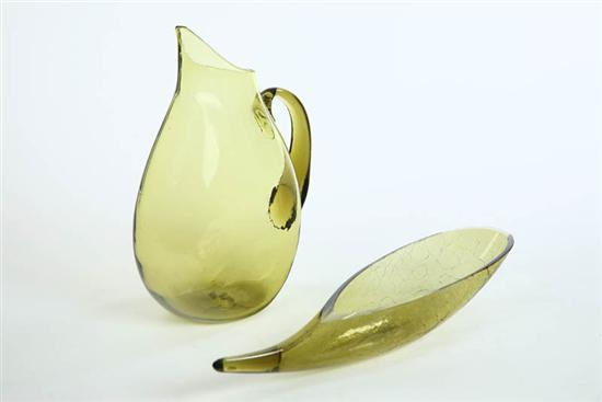 Appraisal: TWO ART GLASS PIECES An amber pitcher with applied handle