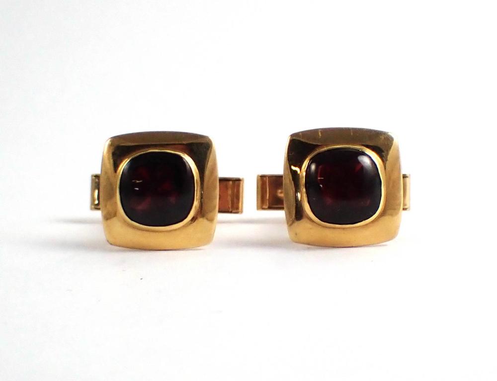 Appraisal: PAIR OF GARNET AND FOURTEEN KARAT GOLD CUFFLINKS each bezel