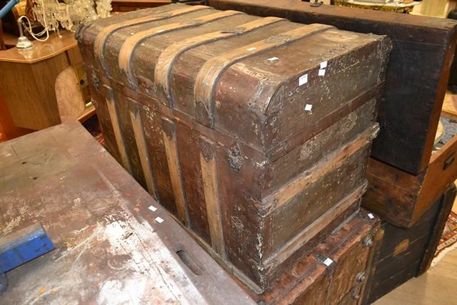 Appraisal: A METAL STORAGE TRUNK WITH WOODEN STRAPPING A METAL STORAGE