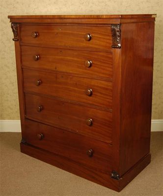 Appraisal: A Victorian mahogany veneer five drawer chest with turned wood