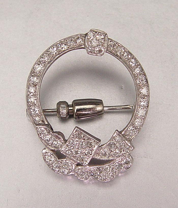 Appraisal: DIAMOND ENCRUSTED CIRCLE BROOCH K white gold circle pin with