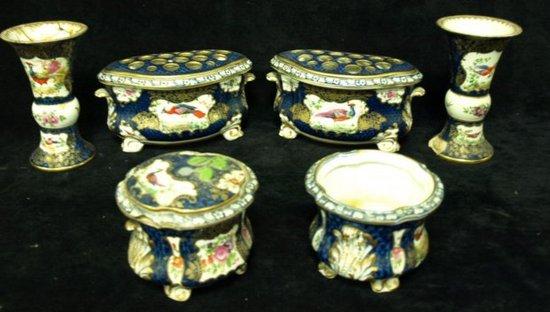 Appraisal: A pair of Staffordshire crocus pots with pierced covers transfer