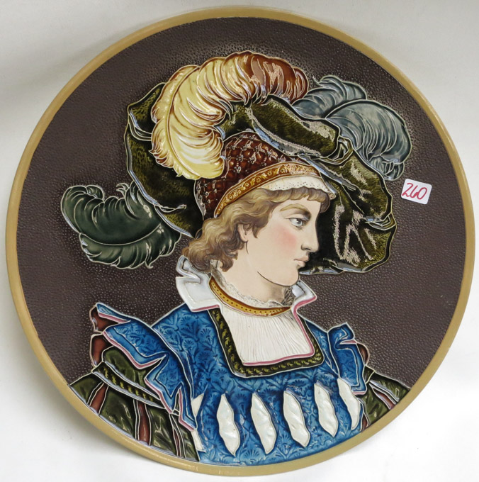 Appraisal: METTLACH ETCHED AND GLAZED POTTERY PLAQUE Woman with Fancy Hat