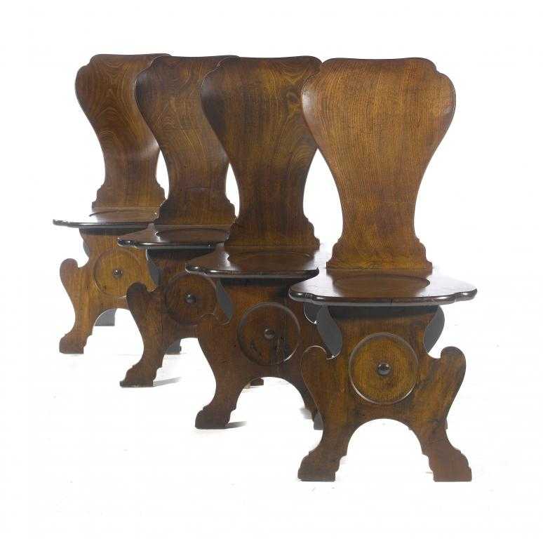 Appraisal: A SET OF FOUR GEORGE II MAHOGANY HALL CHAIRS with