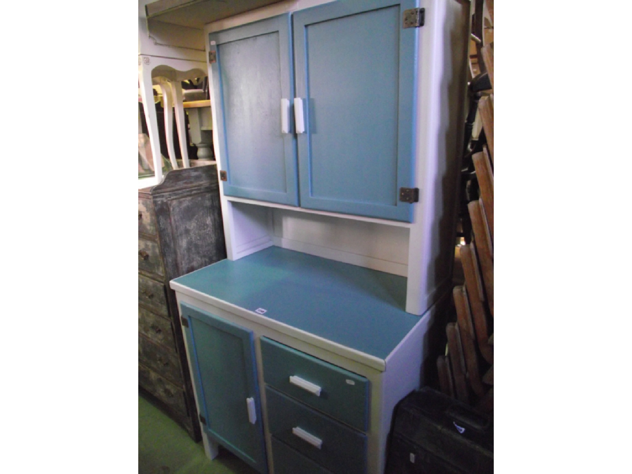 Appraisal: A vintage kitchen cabinet the lower section enclosed by three