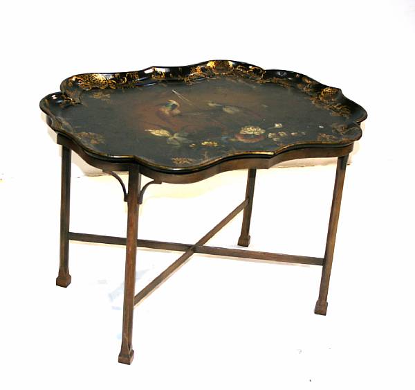 Appraisal: A Victorian style polychrome decorated ebonized tray on stand height