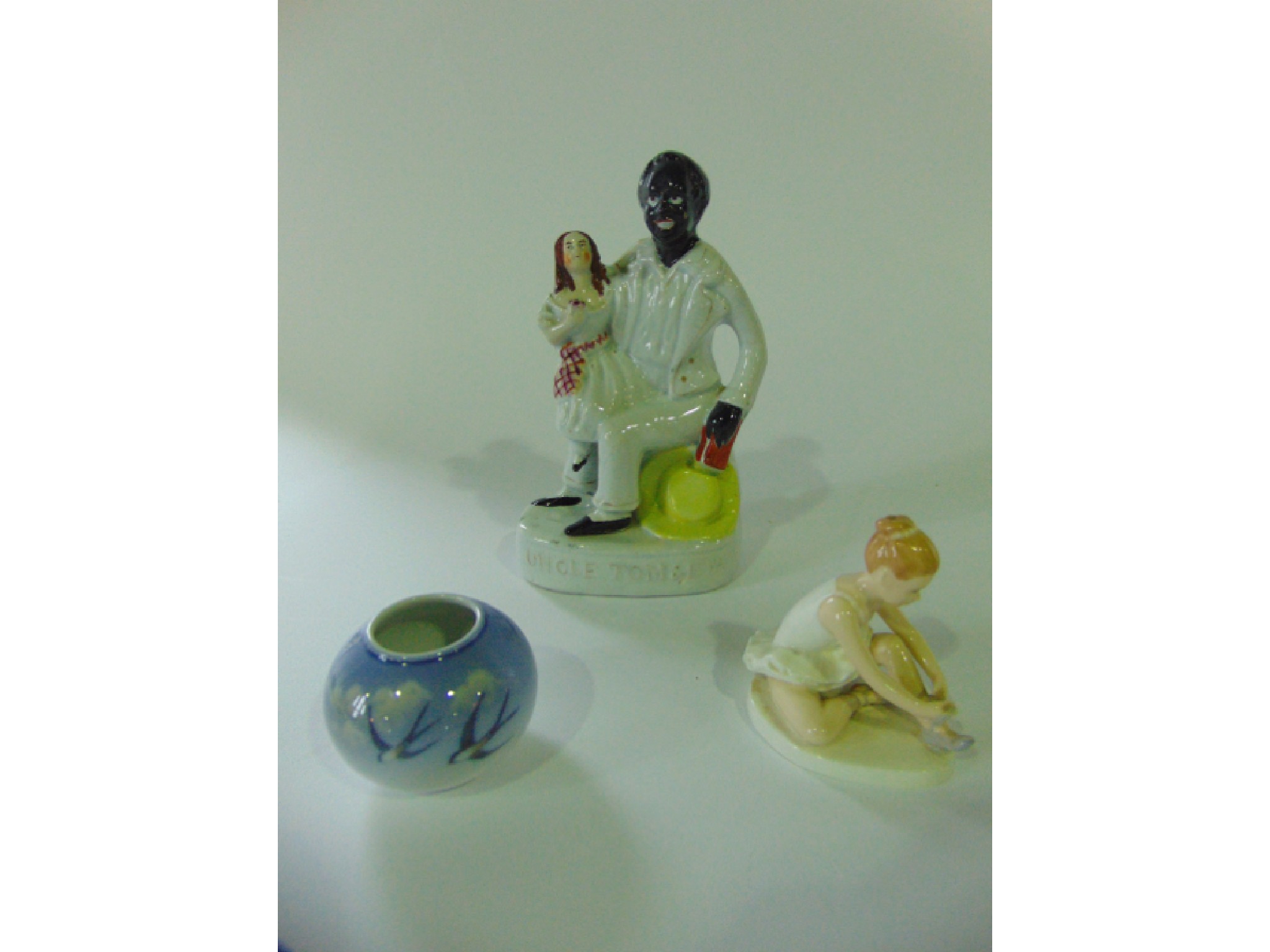 Appraisal: A th century Staffordshire figure of Uncle Tom Eva with