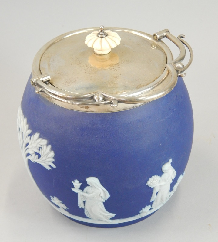 Appraisal: An Edwardian Wedgwood dark blue Jasperware biscuit barrel decorated with