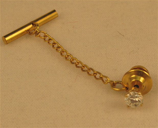 Appraisal: DIAMOND AND FOURTEEN KARAT GOLD TIE TACK set with a