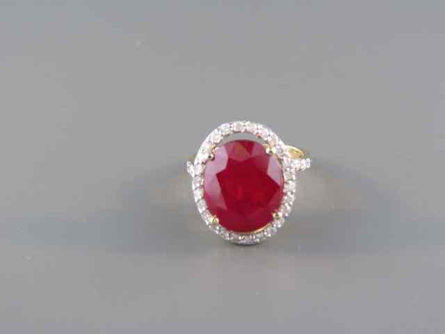 Appraisal: Ruby Diamond Ring carat oval ruby surrounded by diamonds totaling