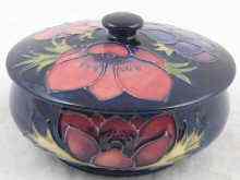 Appraisal: Moorcroft A lidded bowl anemone pattern cm dia in original