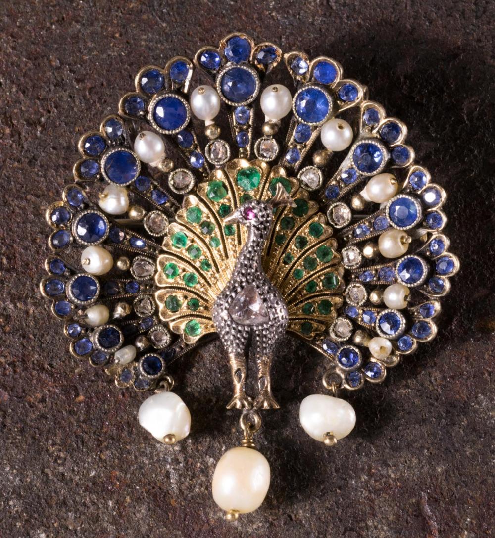 Appraisal: EIGHTEEN KARAT GOLD PEACOCK PENDANT BROOCH set with round-cut sapphires