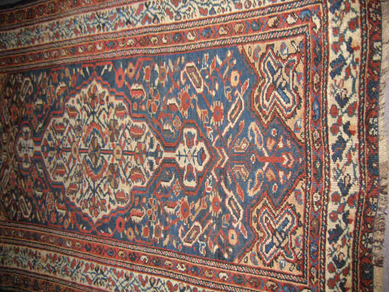 Appraisal: BAKHITARI THROW RUG The indigo field of angular floral design