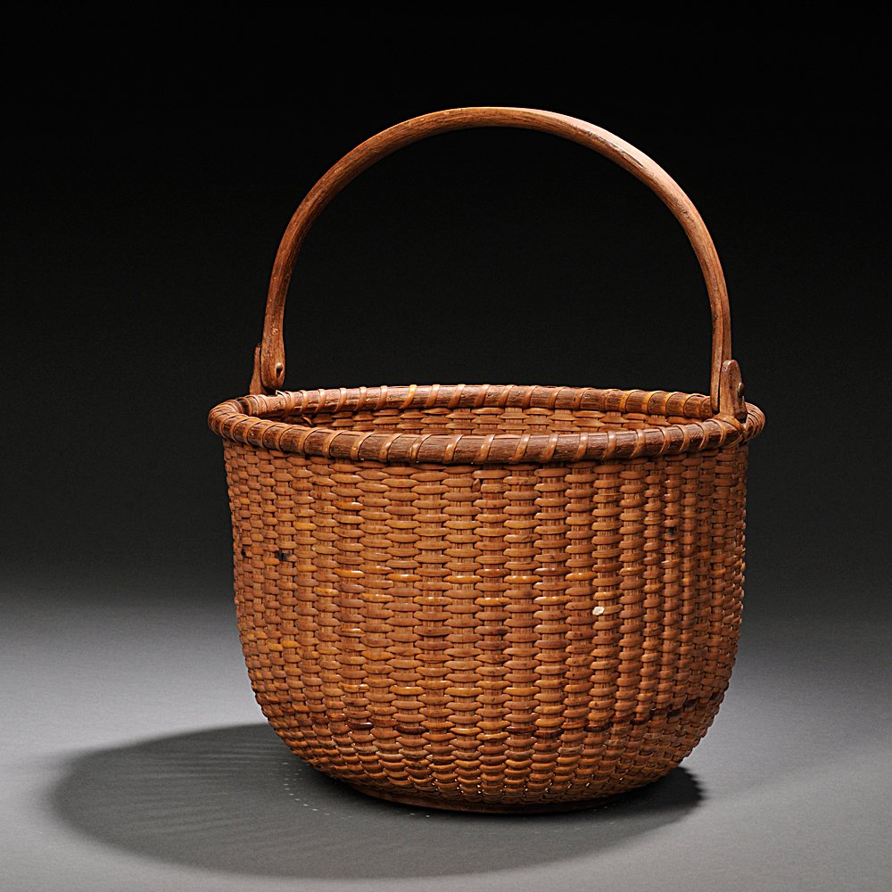 Appraisal: Deep Round Swing-handled Nantucket Basket c with turned base and