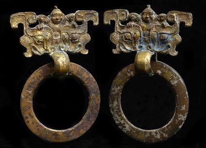 Appraisal: PAIR OF CHINESE GILT-BRONZE HANDLES In form of tiao tieh