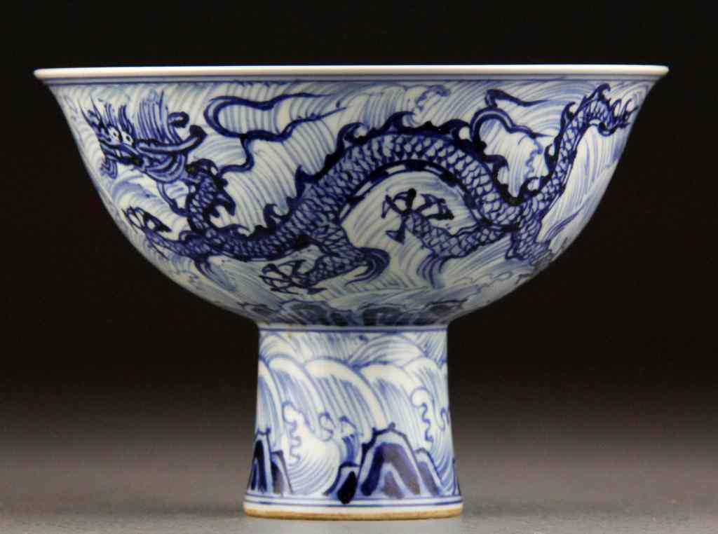 Appraisal: Chinese Blue White Porcelain Wine CupDepicting dragons the interior with