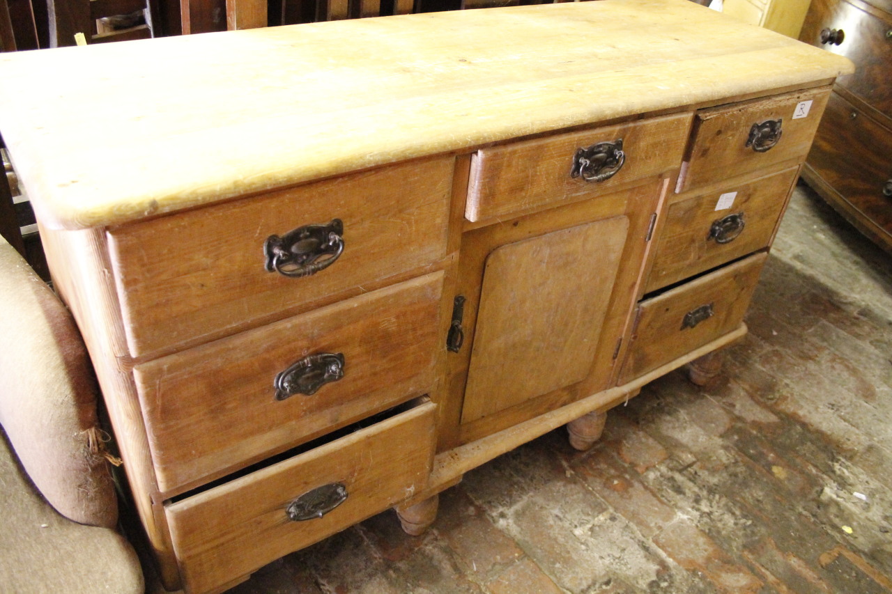 Appraisal: A stripped and lightly polished pine kitchen dresser the oblong