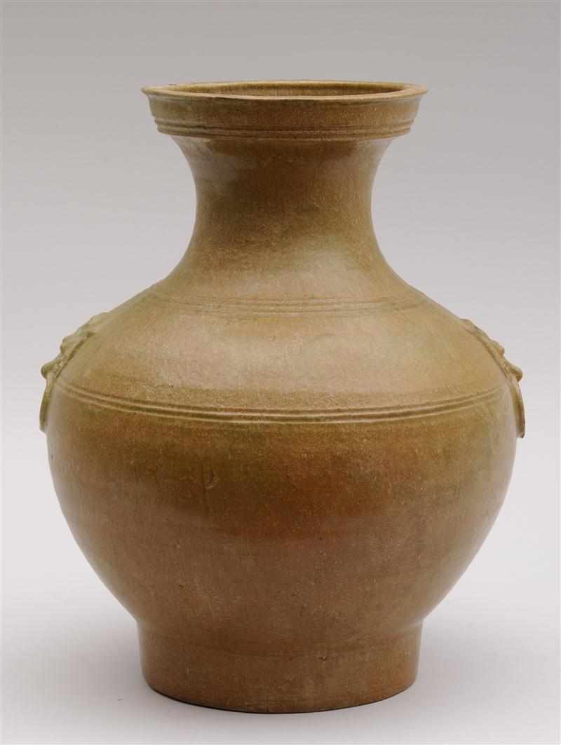 Appraisal: HAN OCHRE-GLAZED POTTERY VASE Archaic bronze hu form the part-ringed