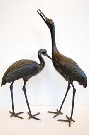 Appraisal: PAIR OF JAPANESE BRONZE GARDEN STORKS