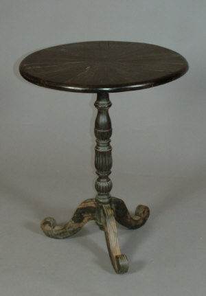 Appraisal: An ebonised hardwood tripod table circa the circular top above