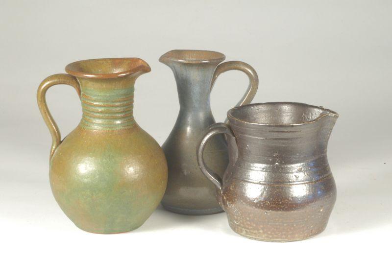 Appraisal: Unsigned Three small pitchers salt glazed stoneware H - green