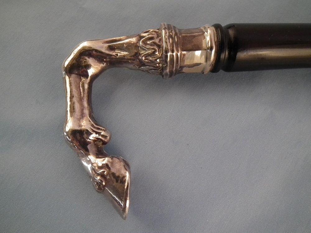 Appraisal: SILVER HORSE LEG CANE Antique silver or silver plated horse