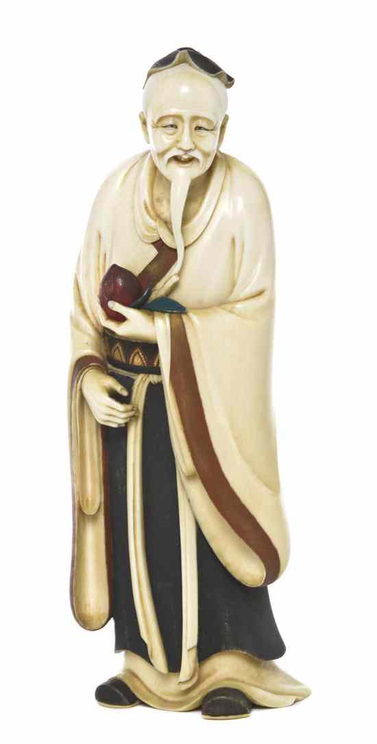 Appraisal: A Japanese Carved Ivory Okimono of a Man having polychrome