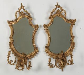 Appraisal: PAIR OF TH C CARVED GILTWOOD ROCOCO STYLE MIRRORED SCONCE