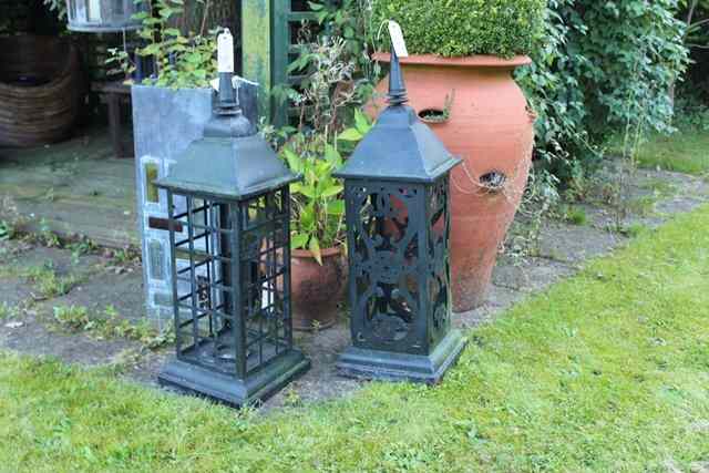 Appraisal: A PAIR OF LARGE BLACK PAINTED TIN CANDLE LANTERNS of