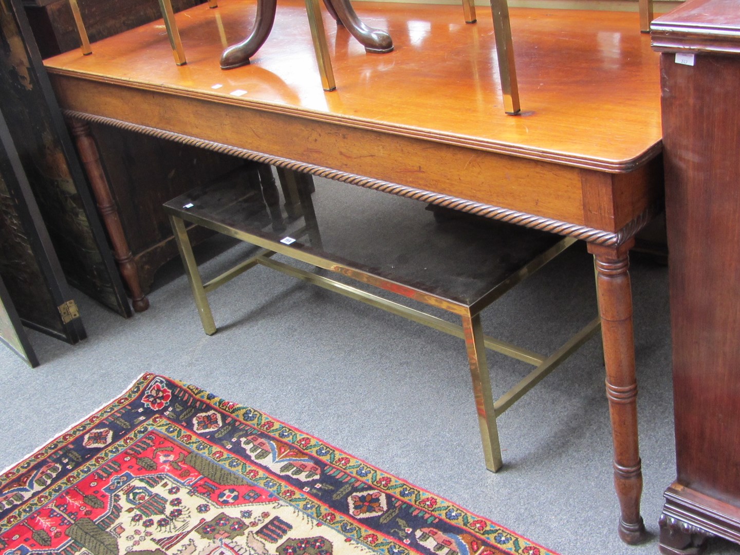 Appraisal: A Regency mahogany serving table the rectangular top over a