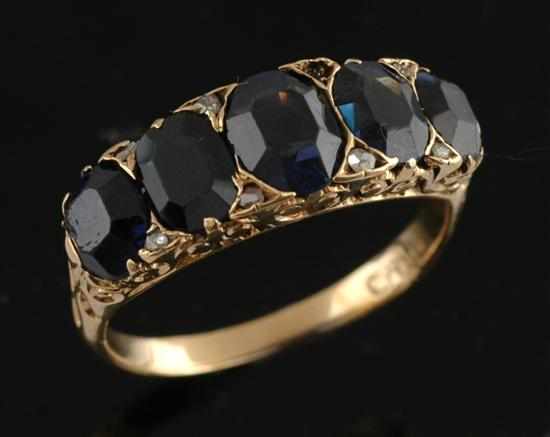 Appraisal: A sapphire and diamond ring Of half hoop design set