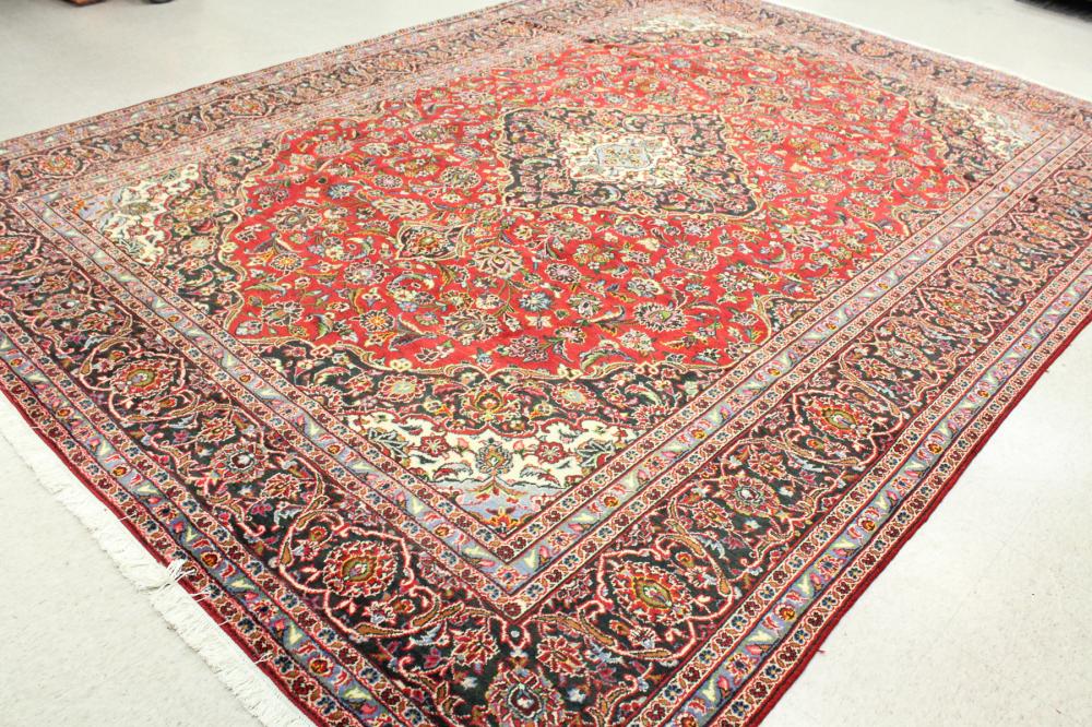 Appraisal: HAND KNOTTED PERSIAN CARPET floral and central floral medallion design