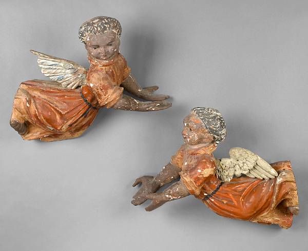 Appraisal: A pair of Spanish Colonial polychrome decorated carved walnut angels