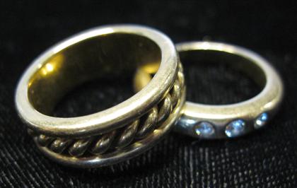 Appraisal: Two lady's karat yellow gold band ringsOne of twist form