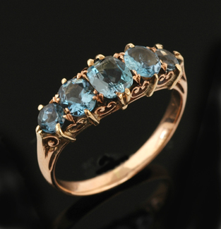 Appraisal: An aquamarine half hoop ring Comprising oval and round cut